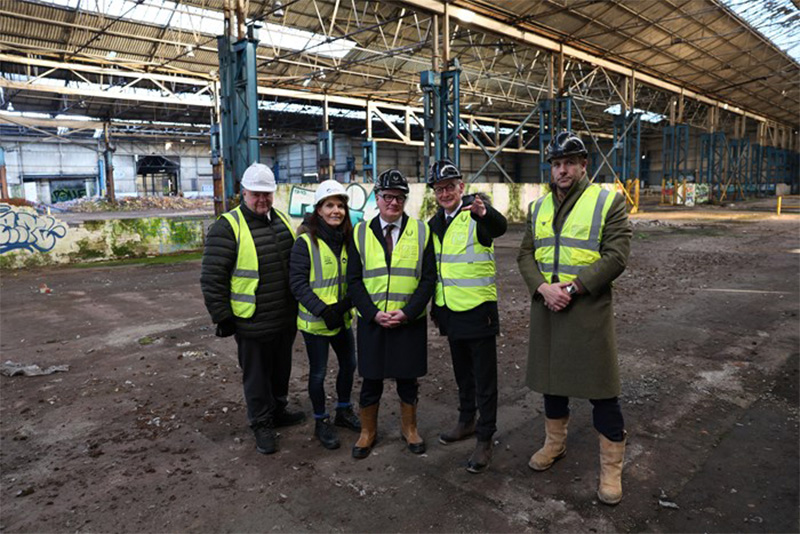 L-R: Cllr Stephen Simkins, City of Wolverhampton Council Leader, Henriette Breukelaar, Regional Director, Canal & River Trust (West Midlands), Richard Parker, Mayor of the West Midlands, Pat McFadden, MP for Wolverhampton South East and James Dickens, Managing Director of Wavensmere Homes inside one of the giant derelict factories that dominate the canalside site.