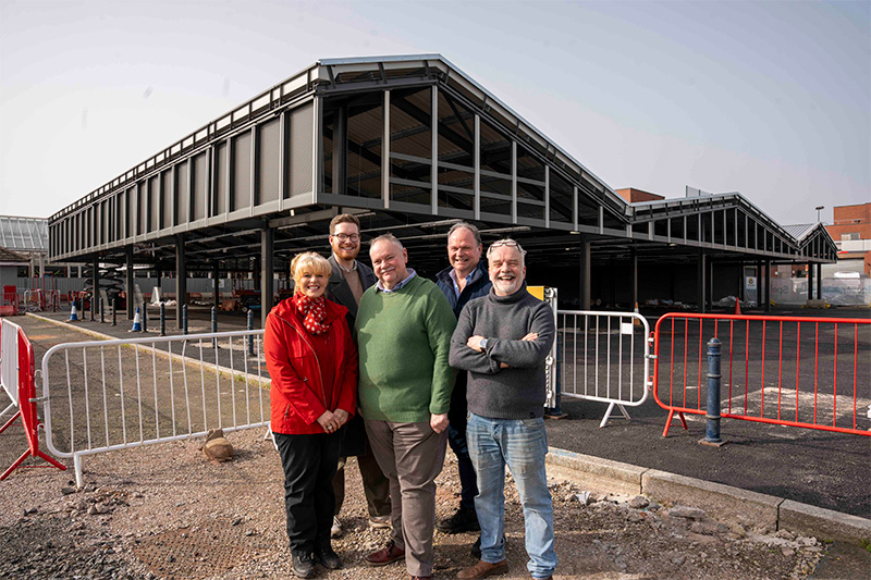 (L-R): Julie Emery (JD Produce), Bilston Market trader, Cllr Chris Burden, Cabinet Member for City Development, Jobs and Skills, Cllr Stephen Simkins, Council Leader, Andrew Pritchard (Pritchard and Son), Bilston Market trader, and Nick Brown (Electrical Discount), Bilston Market trader, at the new Bilston Market development