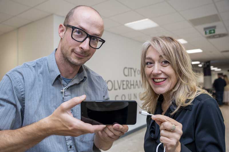 Councillor Jeszemma Howl (right), Cabinet Member for Governance and Digital at City of Wolverhampton Council, and Stefan Paszki (left), Digital Economy Team Officer at City of Wolverhampton Council, appealing for USB-C chargers