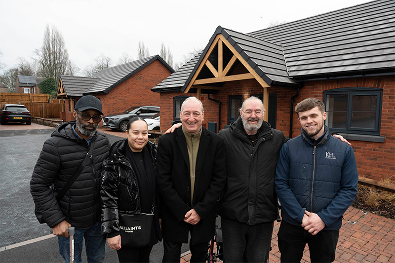 (L-R): Outside the new bungalows are Earl Dixon, Longford Road bungalow resident, with his daughter, Yazmin Forrester, Cllr Steve Evans, Council Deputy Leader and Cabinet Member for City Housing, Stephen Spencer, Longford Road bungalow resident, and Harvey Brand, Keon Homes Site Manager