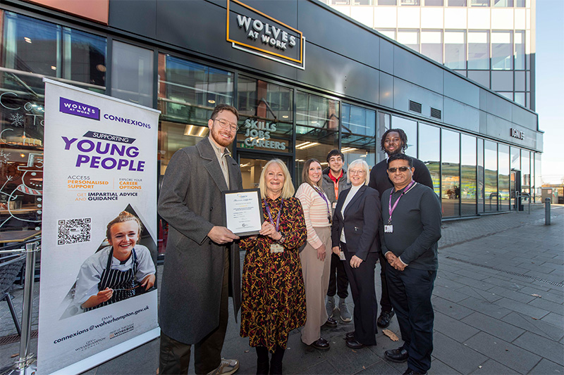 (L-R): Outside the Wolves at Work employment hub based at i10 are front - Councillor Chris Burden, Cabinet Member for City Development, Jobs and Skills, Sue Lindup, Wolverhampton Council Skills, Employability Manager; middle - Lorraine Newton, Connexions Careers Advisor, Julie Obada, Wolverhampton Council Head of Skills, Kirt Patel, Connexions Careers Advisor; back - Carlton Thompson, Wolverhampton Vocational Training Centre student, and Edson Mfutila, Wolverhampton Council Taxi Licensing Officer, who secured his job through Wolves at Work