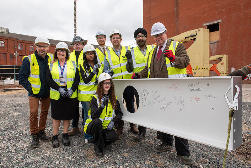 (L-R): City Learning Quarter partners and students come together to sign the first steels for the new city centre campus – Alex Omelchuk, Turner & Townsend Project Manager, Anna Place, Adult Education Wolverhampton Deputy Head of Service, David Byrne, McLaughlin & Harvey Ltd Operations Manager, City of Wolverhampton College students Ellaika Antonius, Level 3 IT, aged 19, and Doina Surchicin, Level 1 IT, 16, Cllr Chris Burden, City of Wolverhampton Council Cabinet Member for City Development, Jobs and Skills, Peter Merry, City of Wolverhampton College Deputy Chief Executive, Ninder Johal DL, Wolverhampton City Investment Board Chair, Cllr Stephen Simkins, City of Wolverhampton Council Leader