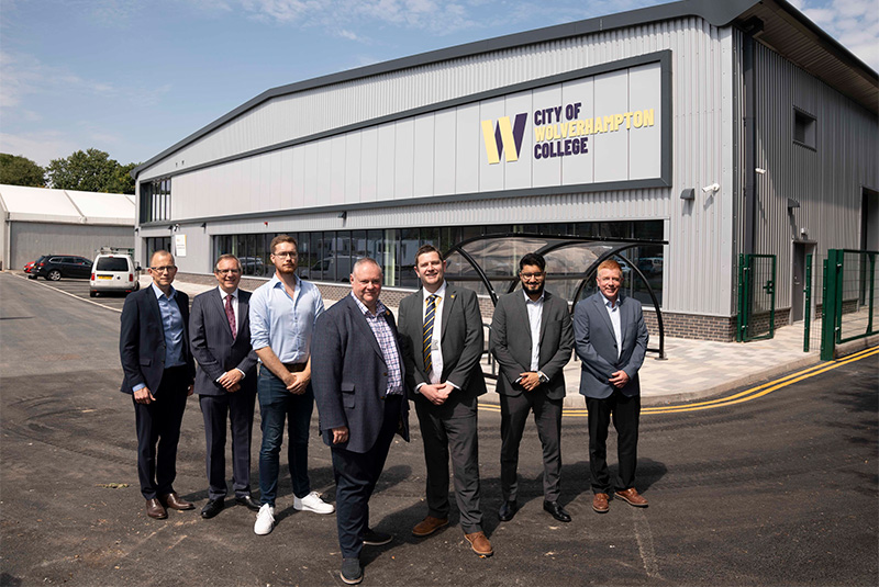 (L-R): Luke Pardoe, Turner & Townsend Associate Director;  Jonathan Astley, The Astley Partnership Architect; Cllr Chris Burden, City of Wolverhampton Council Cabinet Member for City Development, Jobs and Skills; Councillor Stephen Simkins, City of Wolverhampton Council Leader; Peter Merry, City of Wolverhampton College Deputy Chief Executive; Ravi Verma, Turner & Townsend Project Manager; and Rob Lashford, Speller Metcalfe Regional Director, in front of the new Advanced Technology and Automotive Centre)